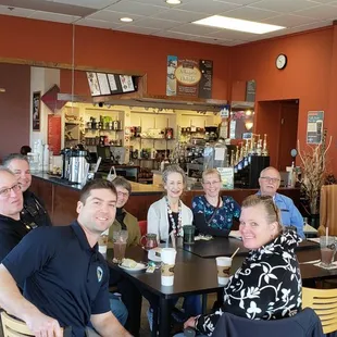 a group of people sitting at a table
