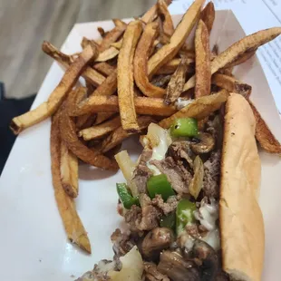 Half a philly cheese steak and fries.  (the other half of the cheese steak was eaten before I could get a photo)