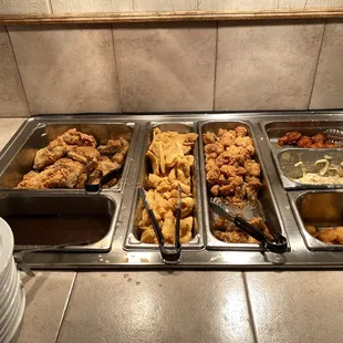 a buffet with a variety of food items