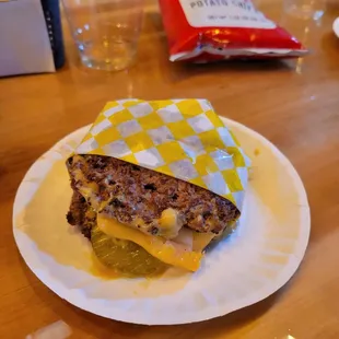 a sandwich on a paper plate