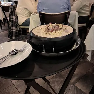 people sitting at a table in a restaurant