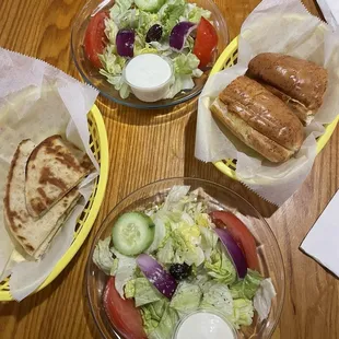 Sad salads with garlic bread and pita bread