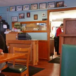 Outside looks like an old pizza place, and inside looks like a cozy diner.