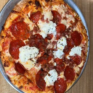 Pepperoni, bacon, and ricotta pizza.