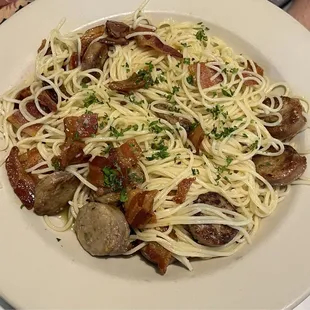 Spaghetti aglio e olio with sausage and bacon