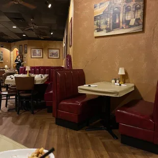 a restaurant with booths and tables