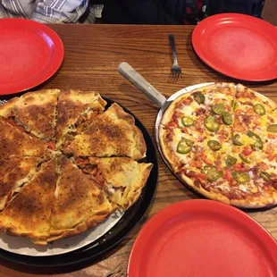 two pizzas on a table