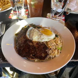 Ribeye with fried rice and greens