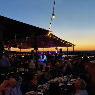 a group of people sitting at a dinner table