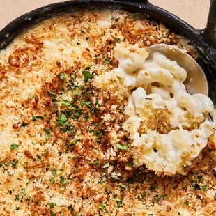 Mac &amp; Cheese w/ aged white cheddar, fontina, parmesan, and buttery crisped bread crumbs.