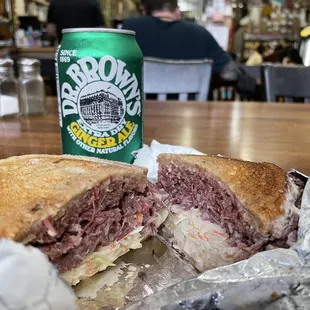 a sandwich and a can of beer