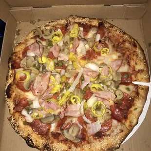 Deluxe, with banana peppers and sesame crust