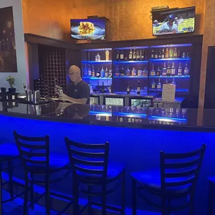 a bar with blue lighting