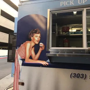 a woman holding a drink