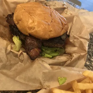 The size of this burger was impressive! The thick bacon on it was crispy and full of flavor. The spicy pickle really added a nice heat.