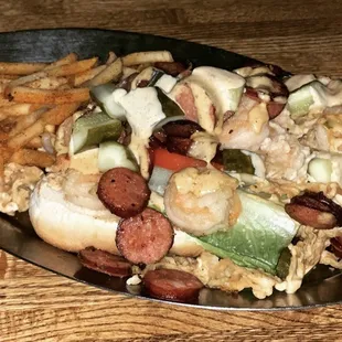 Andouille and shrimp Po Boy with Cajun fries!