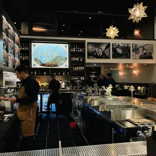 a restaurant with a bar and people