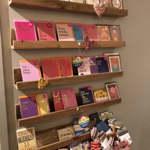 a display of books on wooden shelves