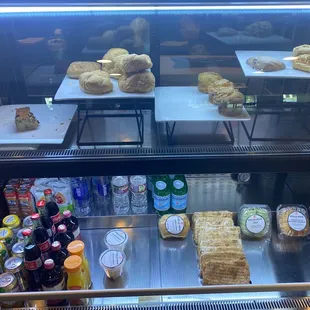 a display case with a variety of baked goods