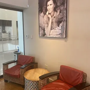 two chairs and a table in a waiting room