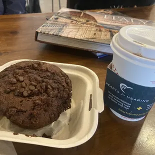 Chocolate muffin and Brazilian black coffee with cinnamon.