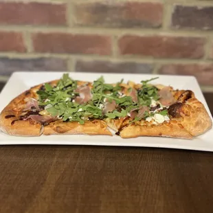 a pizza on a white plate