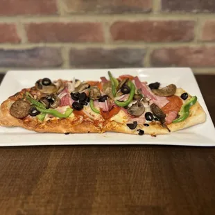 a pizza on a white plate