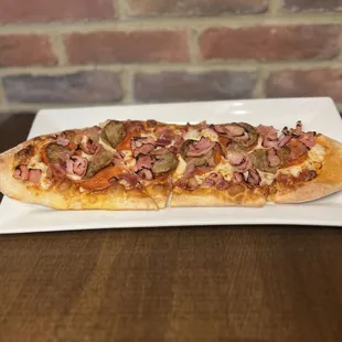 a rectangular plate with a pizza on it