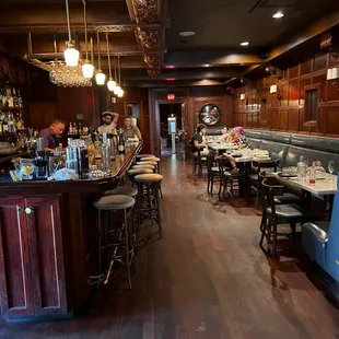 Indoor dining area and bar. Many tables left uncleaned for quite some time.