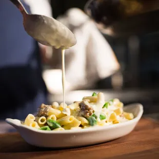 Baked Rigatoni Carbonara - parmesan cream, fennel sausage, snap pea, runny egg