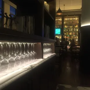 The expansive wine selection at Stella is on display in a glass-enclosed cellar