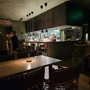 View of open kitchen and open flame grill