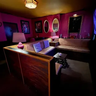  a living room with couches and a bar