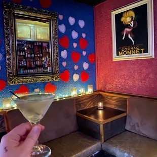  a hand holding a martini