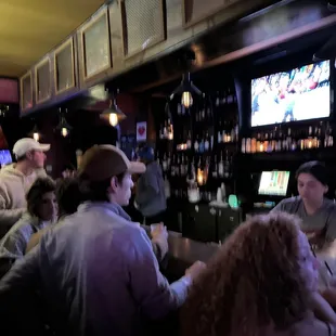  people sitting at a bar