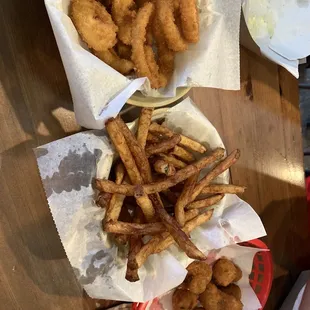 a basket of fried onion rings and a basket of fried onion rings