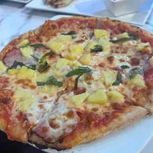 a pizza with pineapple toppings