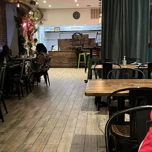 a dining area with tables and chairs