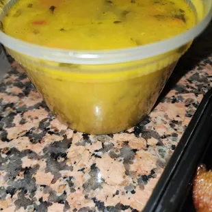 a bowl of soup and a donut