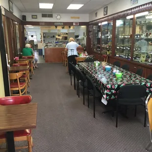 Inside. Quaint, home style joint. Wonderful owners! Antiques and jam for sale in the glass cases on the walls.
