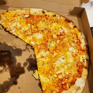 Half eat thin and crispy buff chicken pizza