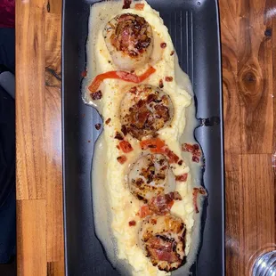 a pan of mashed potatoes and meat