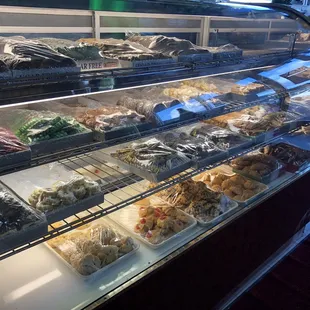 a display case filled with different types of food