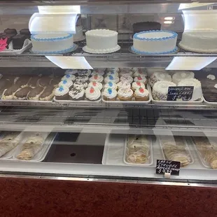 a display case full of cupcakes