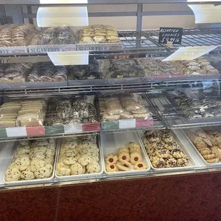 a variety of donuts in a display case