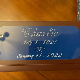 The engraving we had done on dark blue metal for Charlies urn (The date we started fostering, to the day he passed)