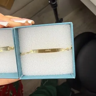 The font is off center, and it's so tiny you can't even read the name!