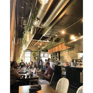 a group of people sitting around a table