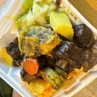 a meal in a styrofoam container