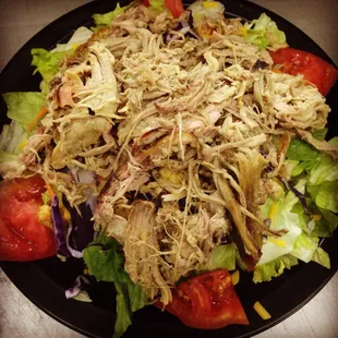 a plate of shredded chicken salad